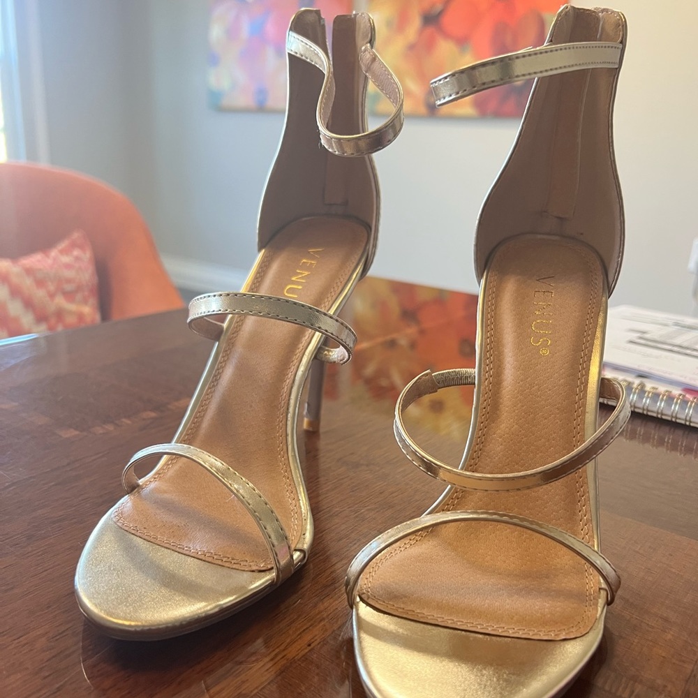 Gold strap heels.  Size 9.  Brand new, never been worn.  Purchased from VENUS.